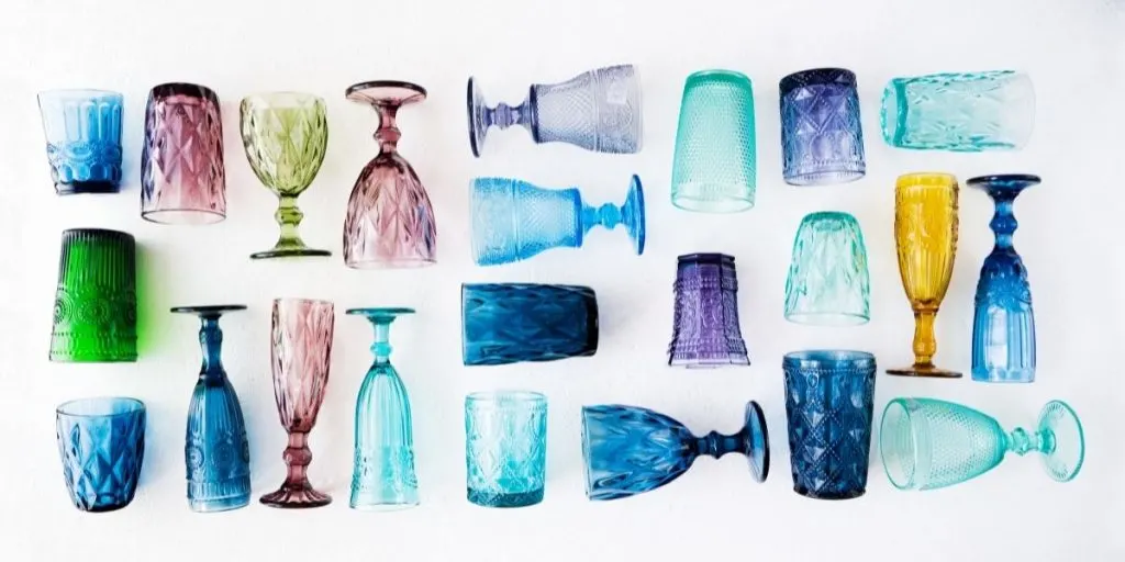 very colorful vintage glassware arranged on a white background