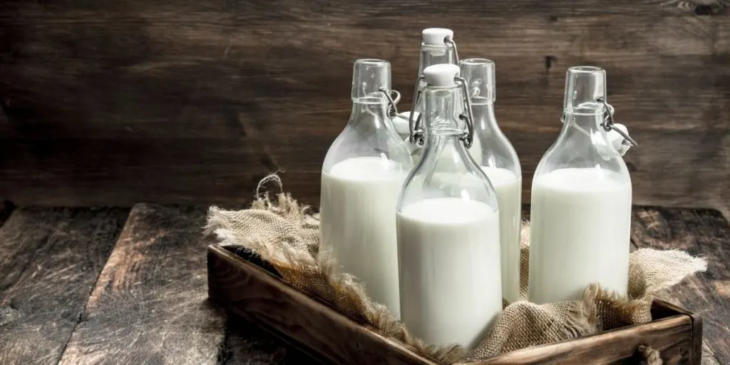 vintage milk bottles in a crate