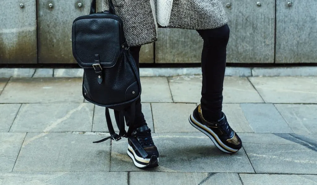 woman in the street wearing platform sneakers