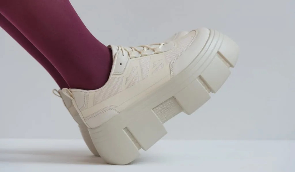 woman wearing platform sneakers