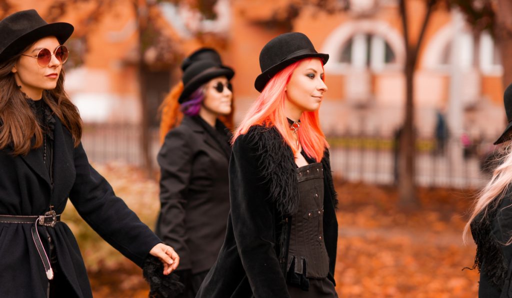 4 gothic women walking outside autumn 