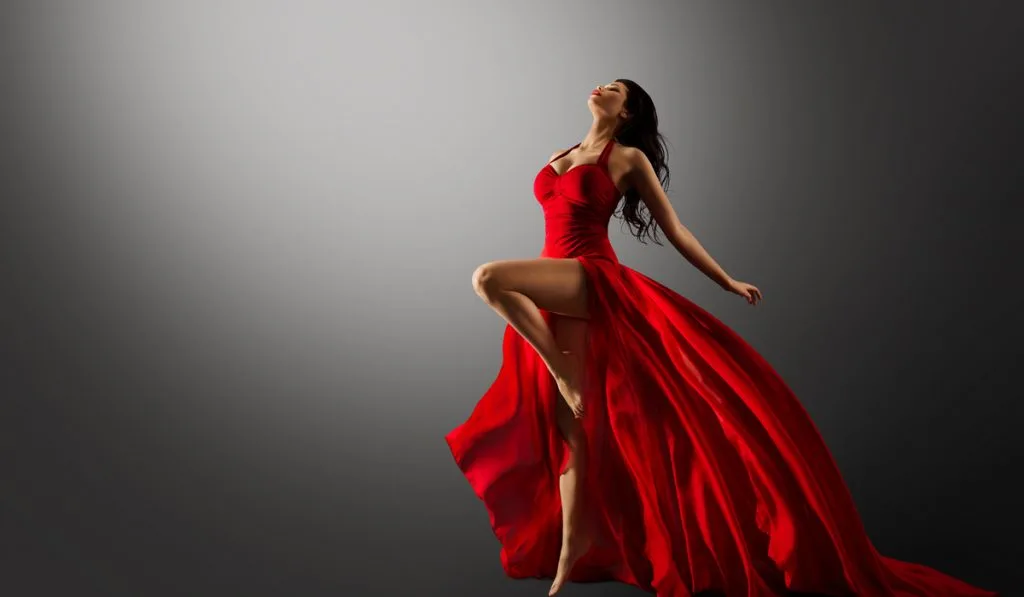 Beautiful lady dancer with red long dress