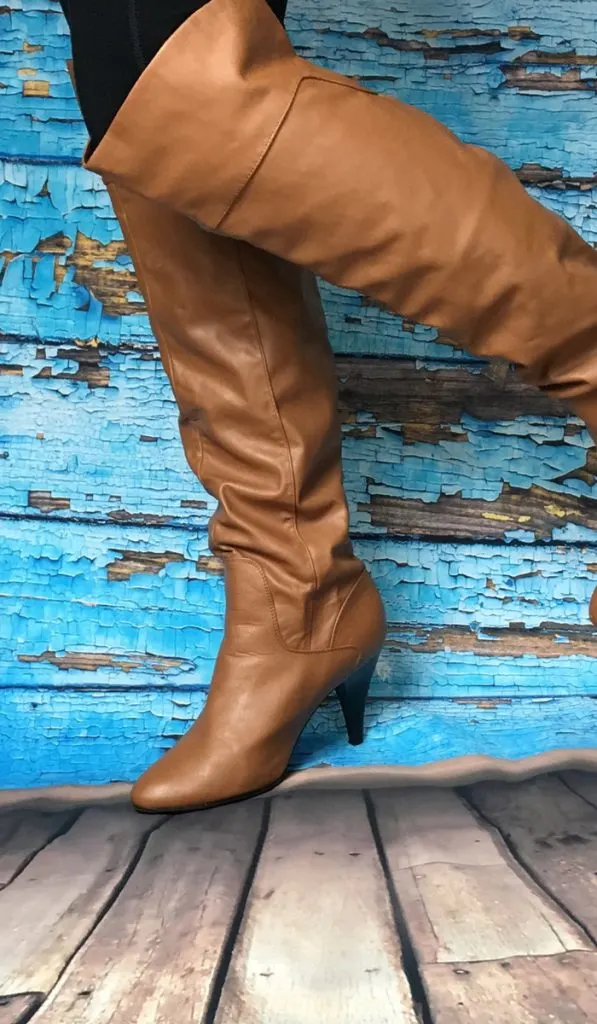  Brown Knee high Boots on blue background 
