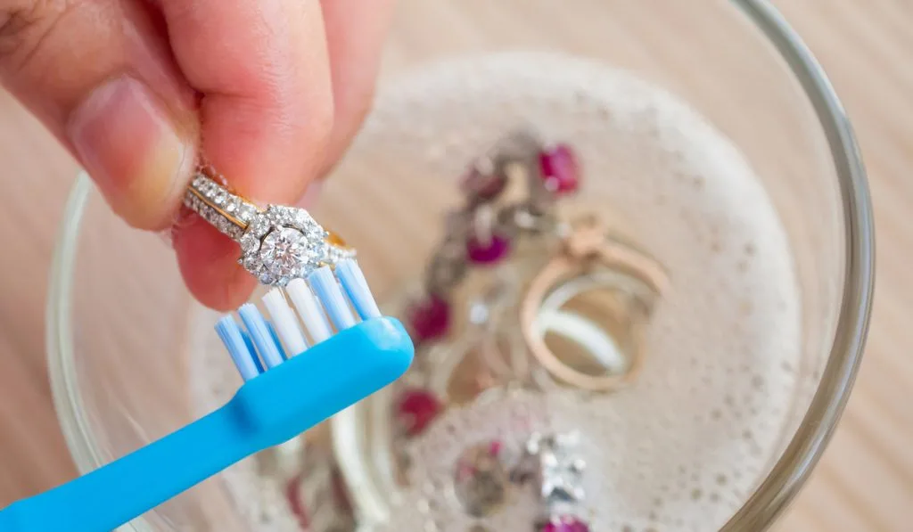 Cleaning a ring using a soft toothbrush
