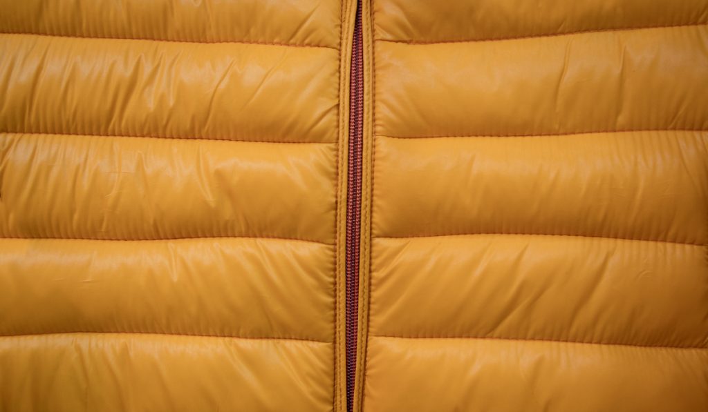 Close-up on yellow puffer jacket texture