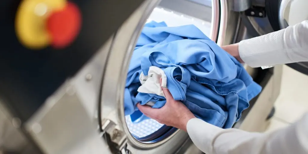 blue shirt into automatic washing machine 