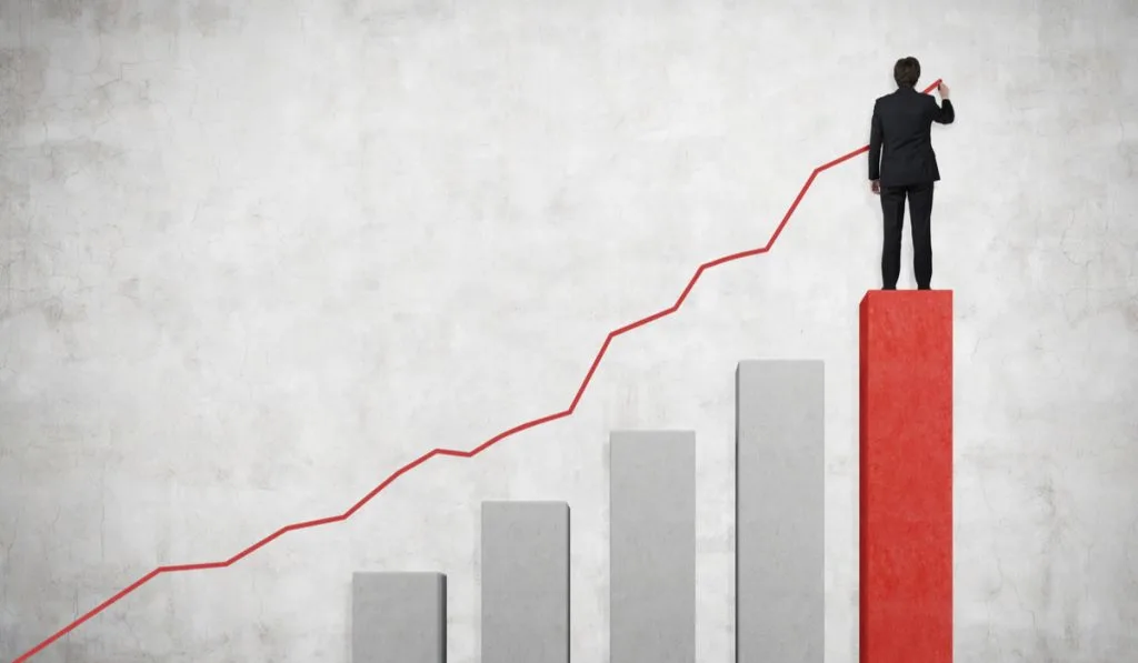 Drawing businessman a line graph and a bar chart