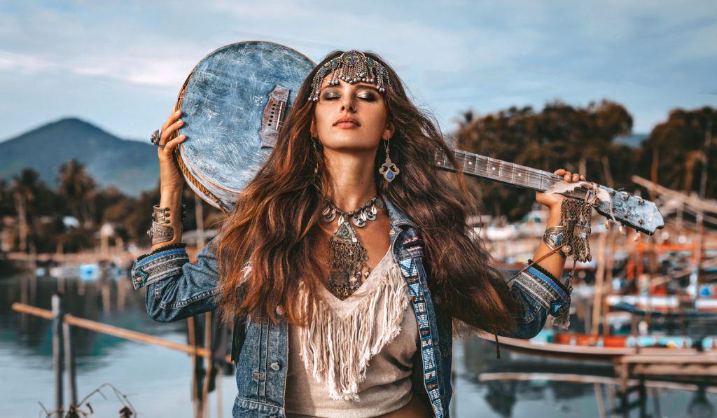 long hair hippy chic with hippy guitar