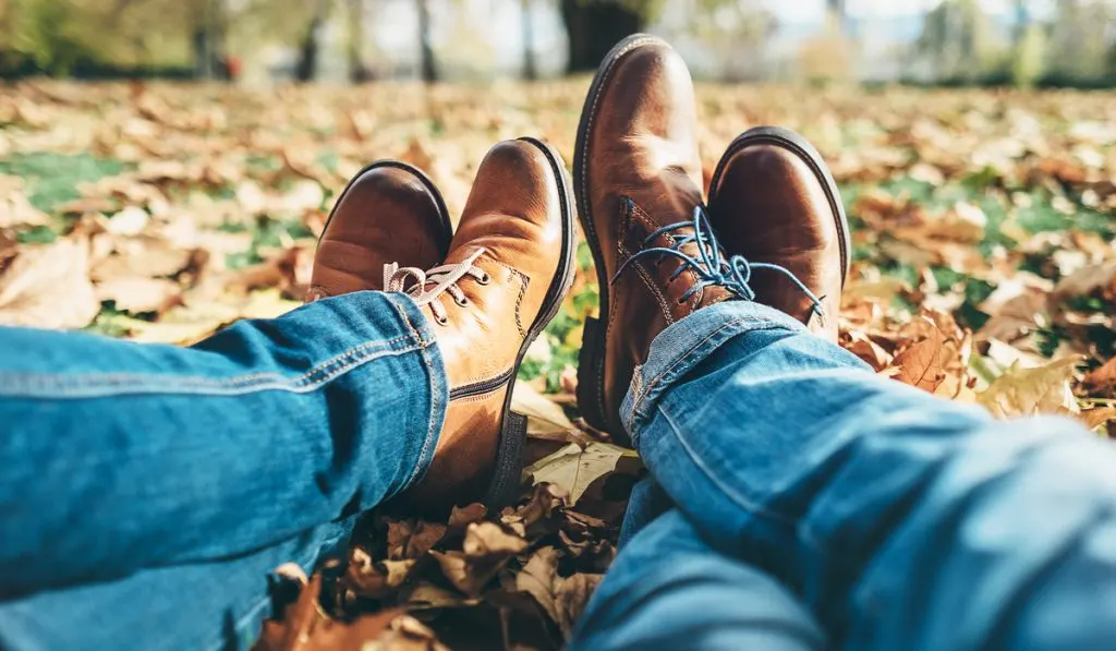 men in comfortable laser shoes and denim pants