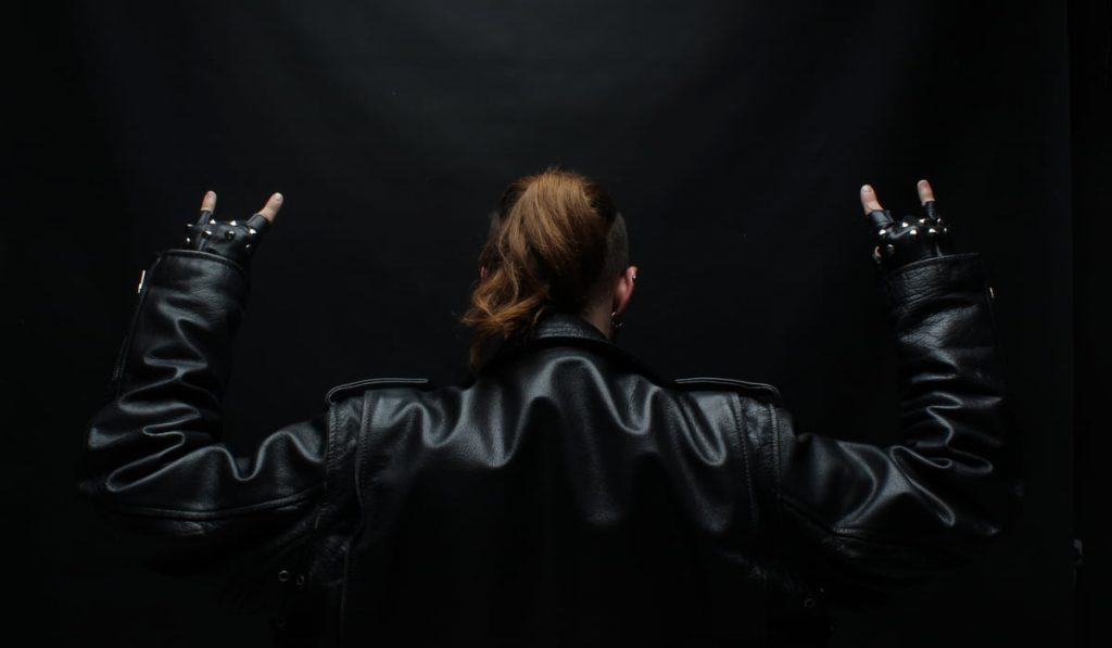metalhead woman wearing leather jacket 