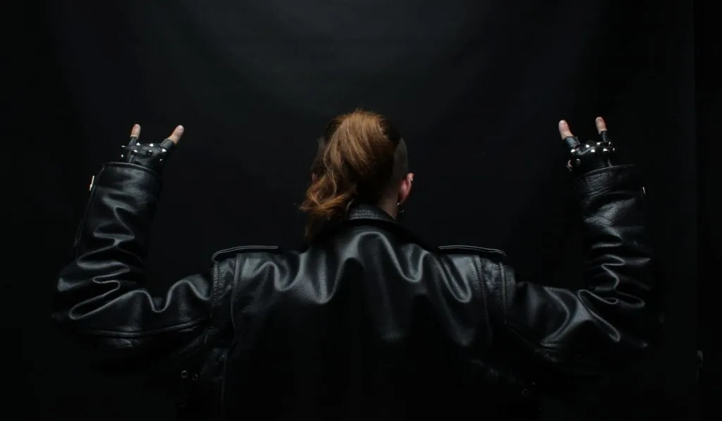 metalhead woman wearing leather jacket 