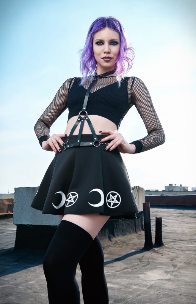 pastel goth girl in cute skirt with purple died hair