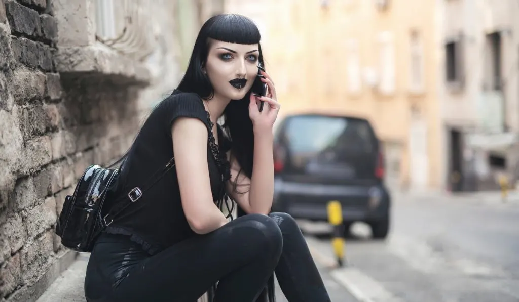urban gothic girl talking over her phone