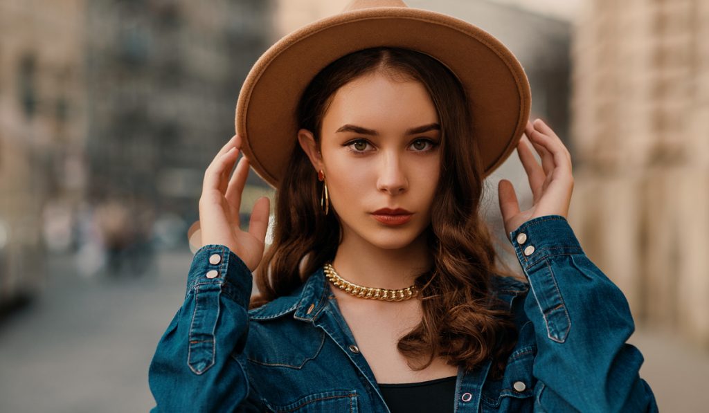  young elegant lady wearing beige fedora hat